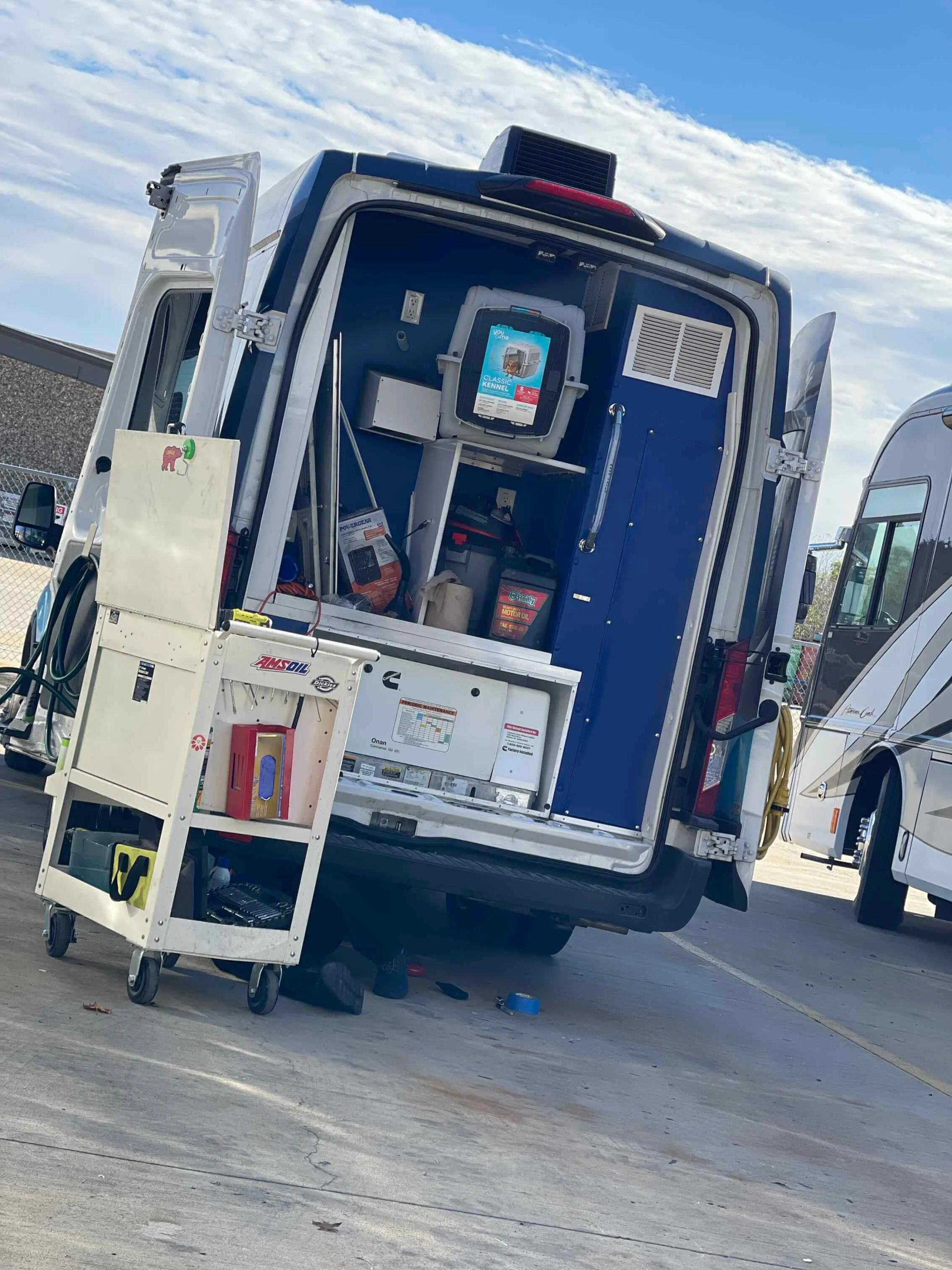 Technician Gene servicing specialty grooming van systems for reliable daily operation