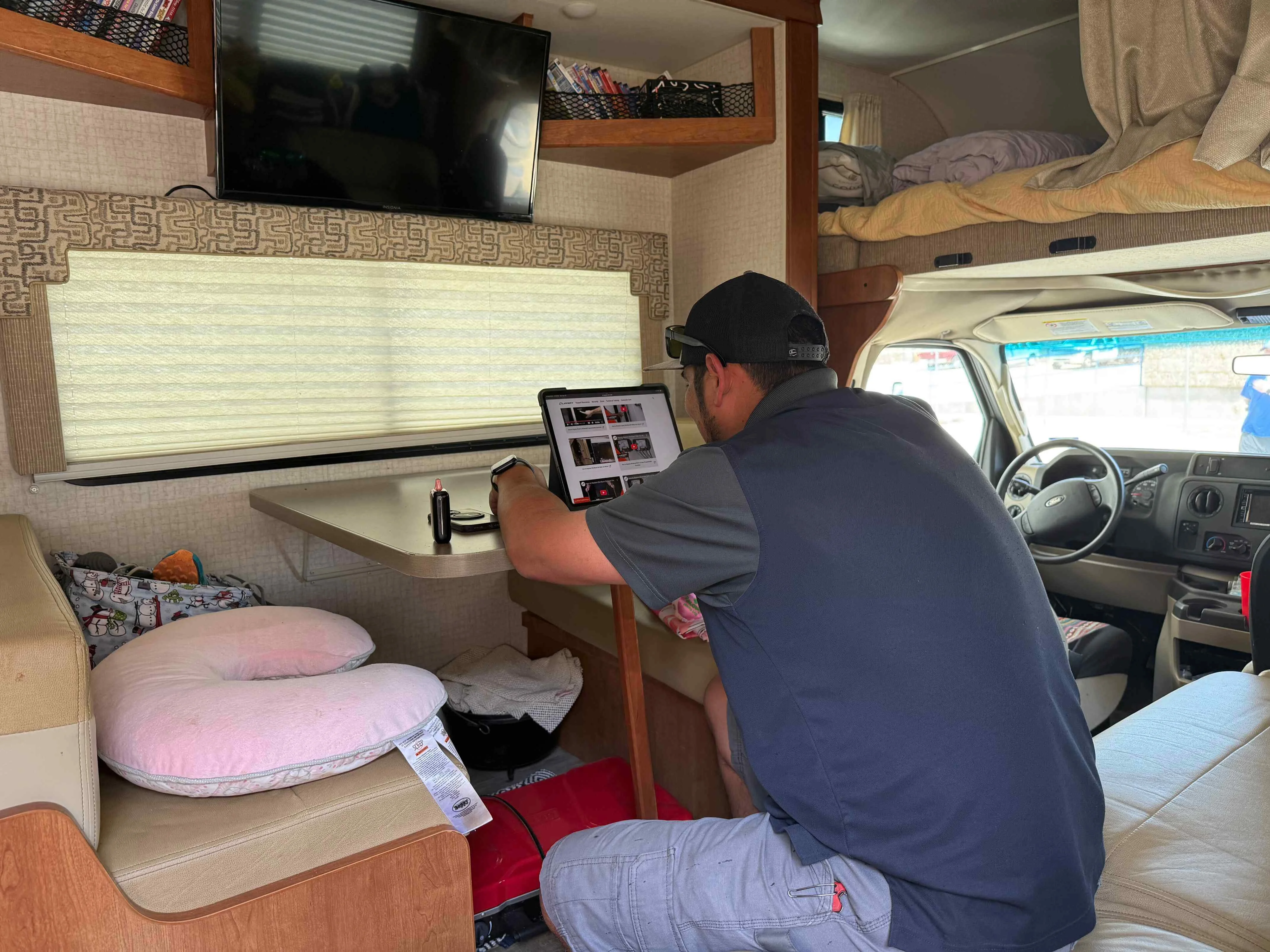 RV service work in progress with open compartments and active systems inspection