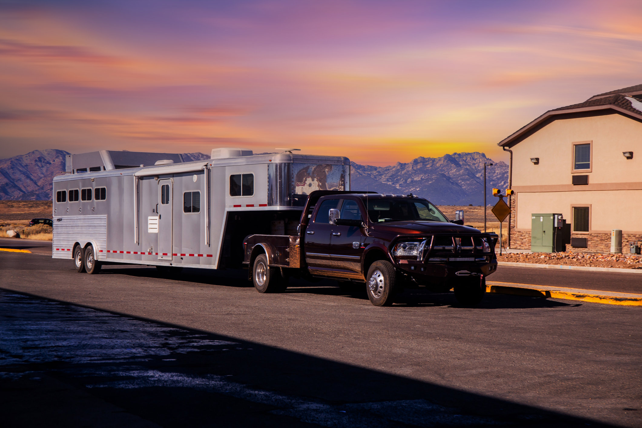Sunset Living Quarters Haul Living quarters horse trailer at sunset near the mountains